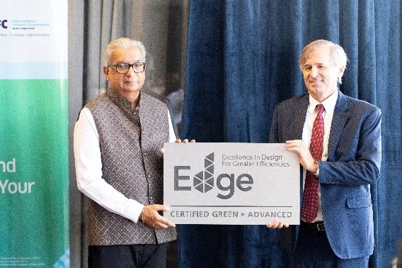 Certification presentation reproduced on Melcom’s infrastructure page. The people and exact event date are not independently identified in this caption.