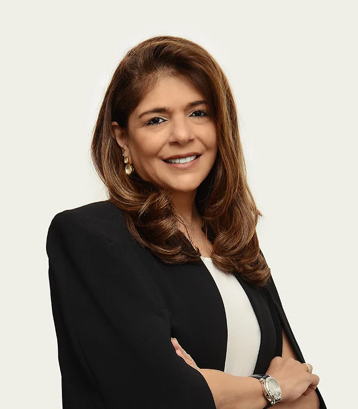Sonya Sadhwani, listed as Group Executive Director on the reviewed corporate leadership page.