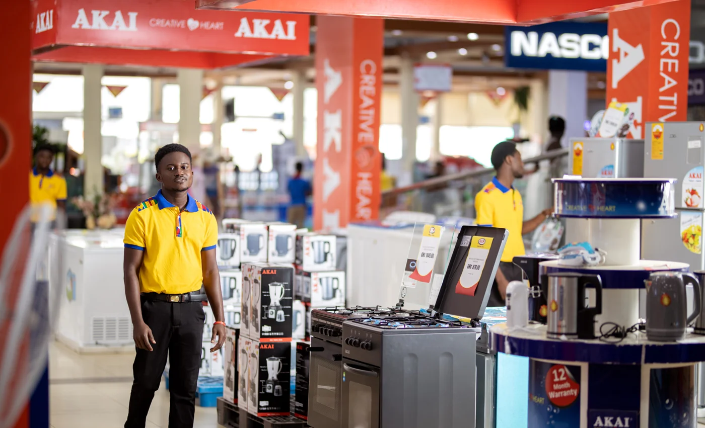 Appliance department in a Melcom-hosted promotional photograph. Branch and capture date are unconfirmed.