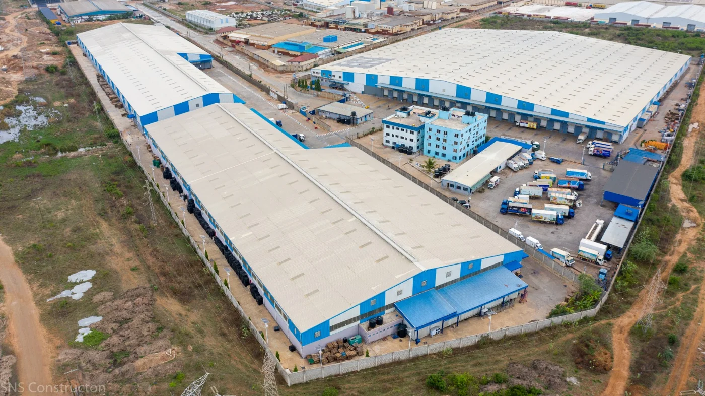 Aerial view of facilities illustrated on Melcom’s supply chain infrastructure page. The page identifies its logistics base at Tema Free Zone.
